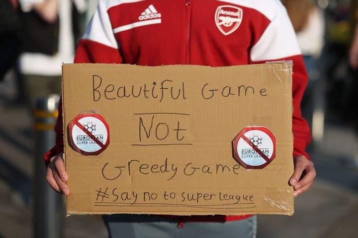 Fans display banners at The Emirates opposing Arsenal signing up for the newly proposed Super League.