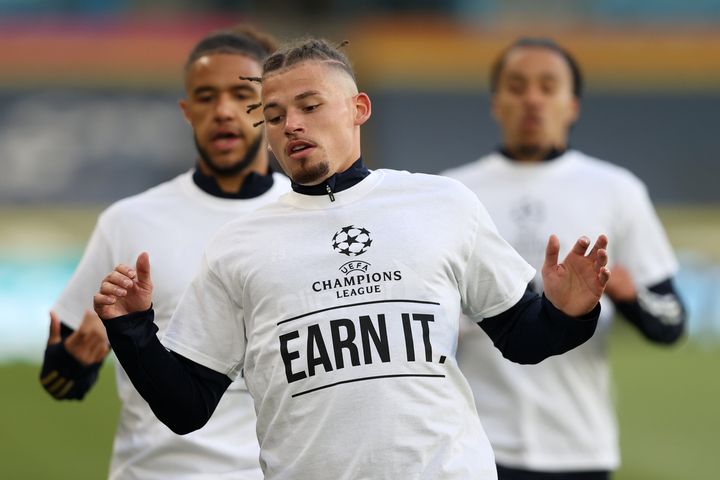 Kalvin Phillips of Leeds United warms up while wearing a protest T-shirt reading "Champions League. Earn It."