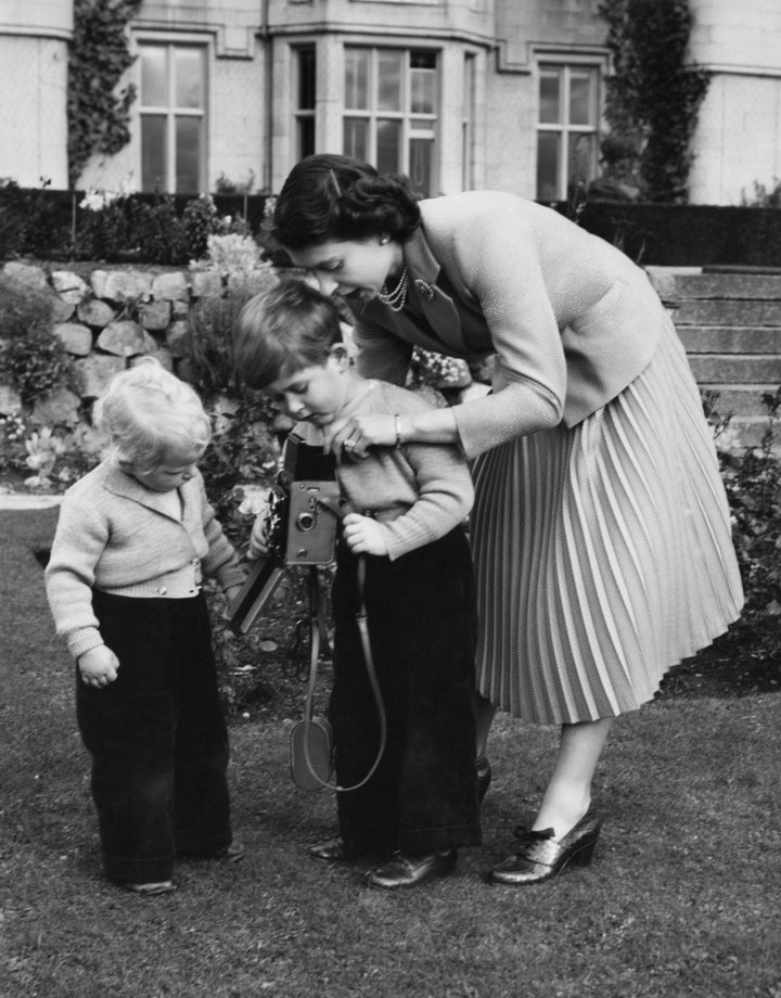 The Queen helps Prince Charles take a picture of his sister, Princess Anne, in Balmoral, Scotland, in 1952.