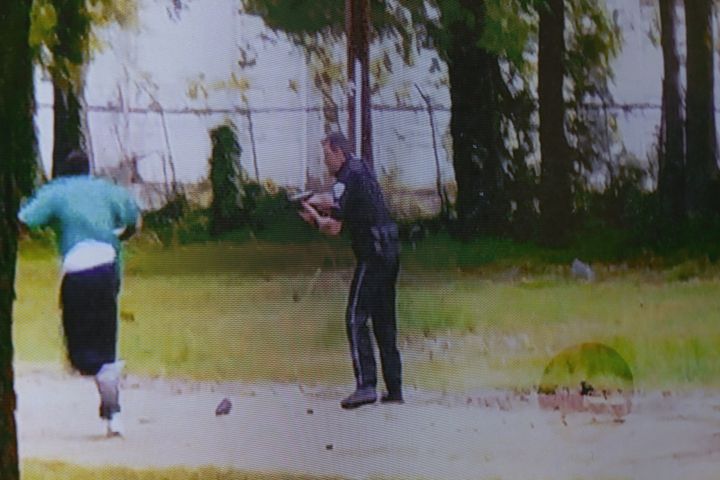 A video showing Slager (R) and Scott is shown in court during Slager's murder trial. Slager shot Scott five times in the back