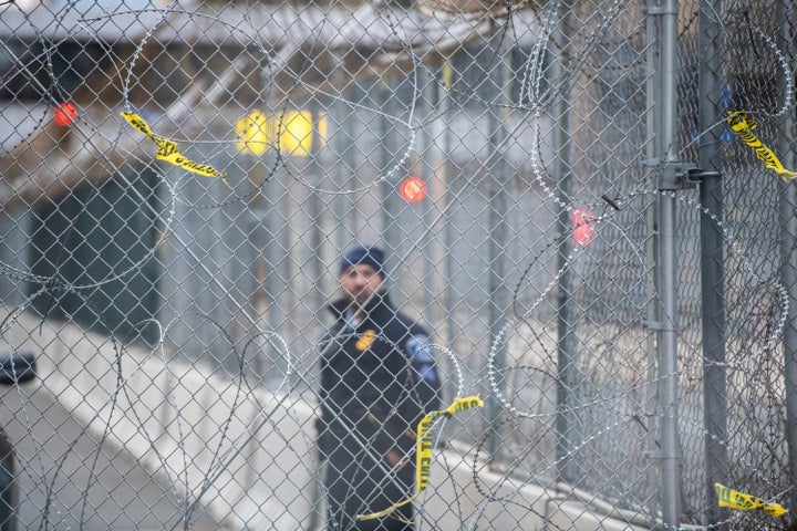 A police officer looks out at protestors through fencing and barbed wire near the Hennepin County Government Center on April 19, 2021, the day of closing arguments and the beginning of jury deliberation in the Derek Chauvin Trial in Minneapolis, Minnesota. (Photo: Chris Tuite /ImageSPACE/MediaPunch /IPX)