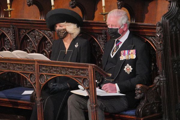 Camilla, Duchess of Cornwall and Prince Charles sit during the funeral service.