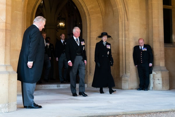 The Prince of Wales and The Princess Royal follow the Land Rover Defender carrying the Duke of Edinburgh's coffin