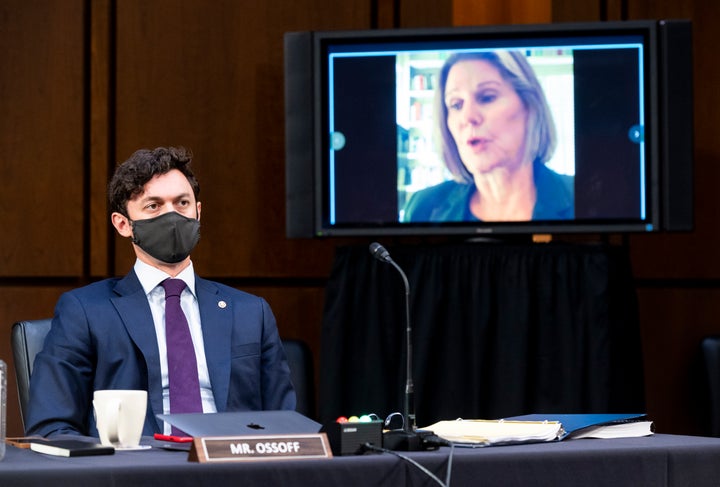 Sen. Jon Ossoff (D-Ga.) listens as Jan Jones, speaker pro tempore in the Georgia House of Representatives, speaks during a Senate Judiciary Committee hearing on Capitol Hill on Tuesday. The committee is hearing testimony on voting rights in the U.S.