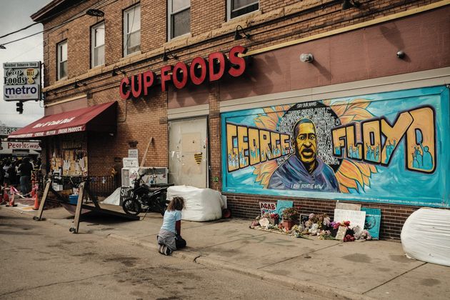 <strong>A woman pays respect to a mural of George Floyd by the Cup Foods where he was killed by Minneapolis Police Officer Derek Chauvin in Minneapolis, Minnesota.</strong>” data-caption=”<strong>A woman pays respect to a mural of George Floyd by the Cup Foods where he was killed by Minneapolis Police Officer Derek Chauvin in Minneapolis, Minnesota.</strong>” data-rich-caption=”<strong>A woman pays respect to a mural of George Floyd by the Cup Foods where he was killed by Minneapolis Police Officer Derek Chauvin in Minneapolis, Minnesota.</strong>” data-credit=”SOPA Images via Getty Images” data-credit-link-back=”” /></p>
<div class=