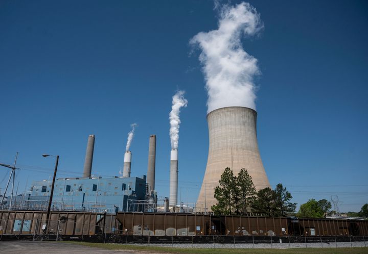 Steam rises from the Miller coal Power Plant in Adamsville, Alabama, on April 13. Power stations like this would likely need to shut down by the end of this decade to hit Biden's climate goals.