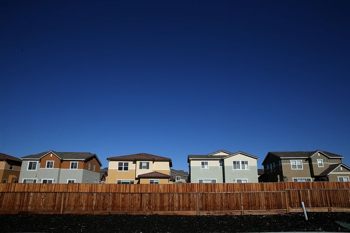 A row of new single-family homes at a housing development in Dublin, California. Encouraging all-electric homes would contribute to the progress.