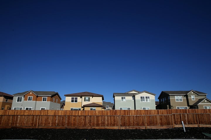 A row of new single-family homes at a housing development in Dublin, California. Encouraging all-electric homes would contribute to the progress.