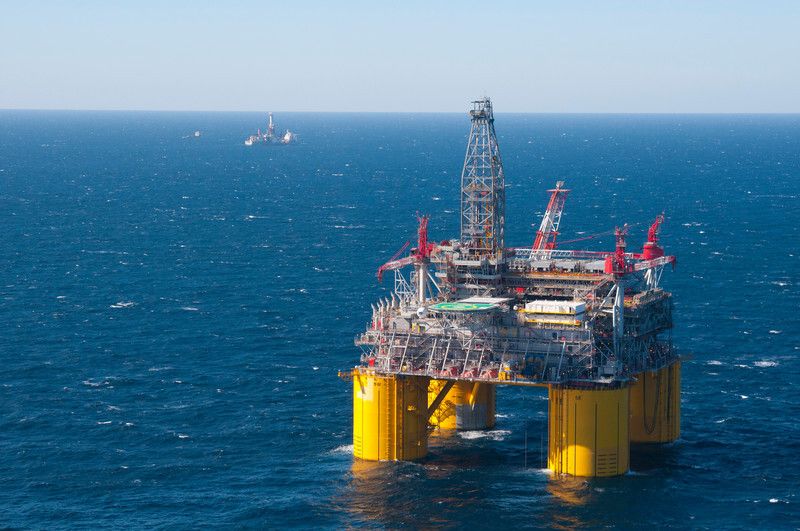 Shell's offshore platform Olympus, part of the company's Mars deepwater project, is pictured in the Mississippi Canyon area of the Gulf of Mexico in 2014. One of Shell's drillships is pictured in the background. 