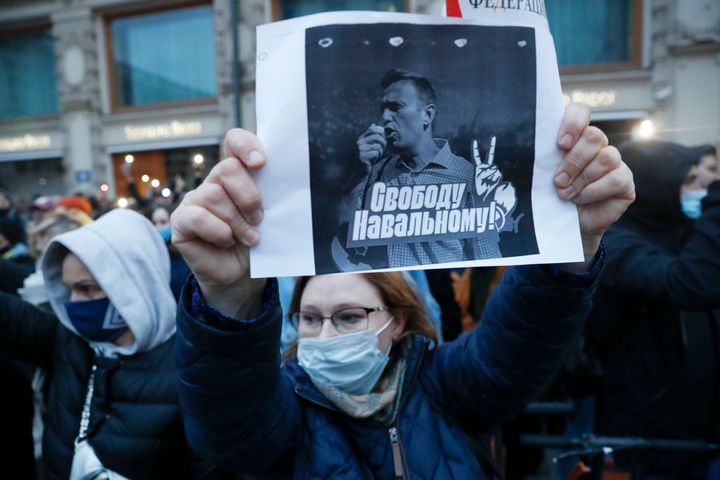A activist holds a poster reading "Freedom for Navalny!" during the opposition rally in support of jailed opposition leader Alexei Navalny in Moscow, Russia, Wednesday, April 21, 2021. (AP Photo/Pavel Golovkin)