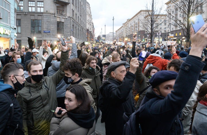 People light their cell phones during a protest in support of jailed opposition leader Alexei Navalny in Moscow, Russia, Wedn