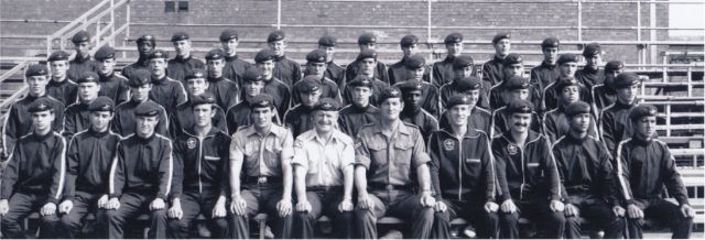Christopher is pictured with his platoon (second row, fifth from right)