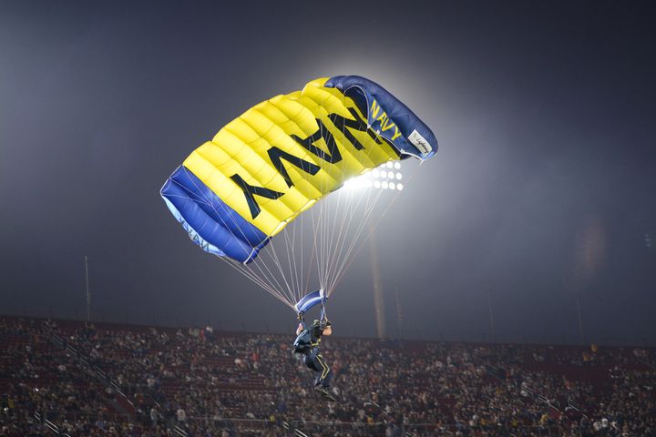 The Navy Seals Leap Frog Parachute Team descends onto the field ahead of the game between the Los Angeles Rams and the Chicago Bears at Los Angeles Memorial Coliseum on Nov. 17, 2019, in Los Angeles, California. 
