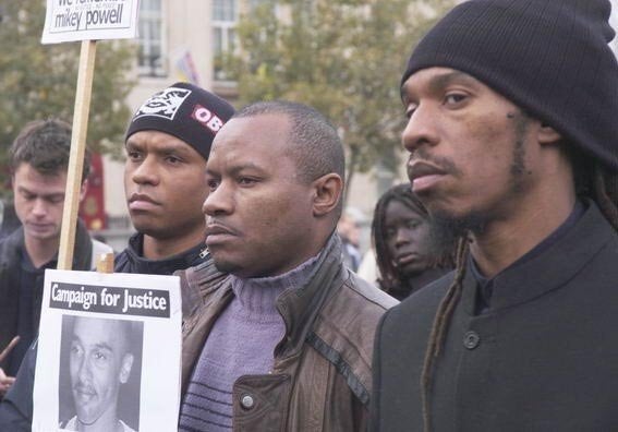 Zephaniah (right) with his brothers Dave Springer (left) and Tippa Naphtali (centre) campaigning over the death of their cousin Mikey Powell