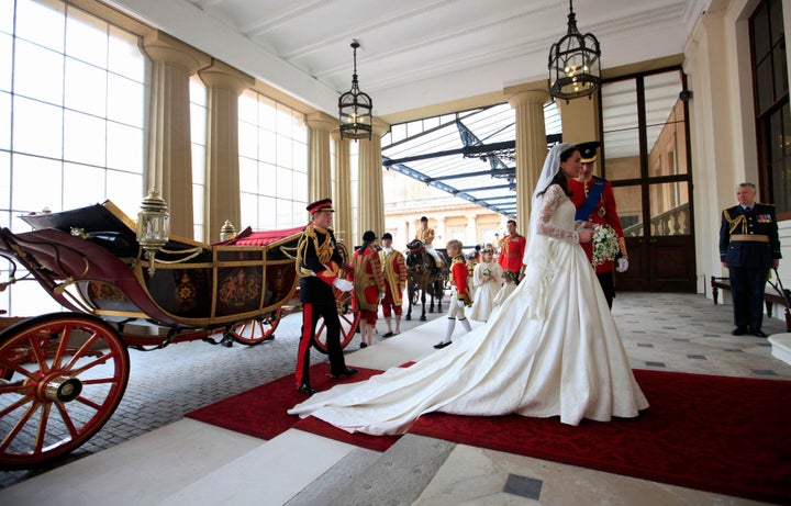 The couple arrives at Buckingham Palace after the wedding.