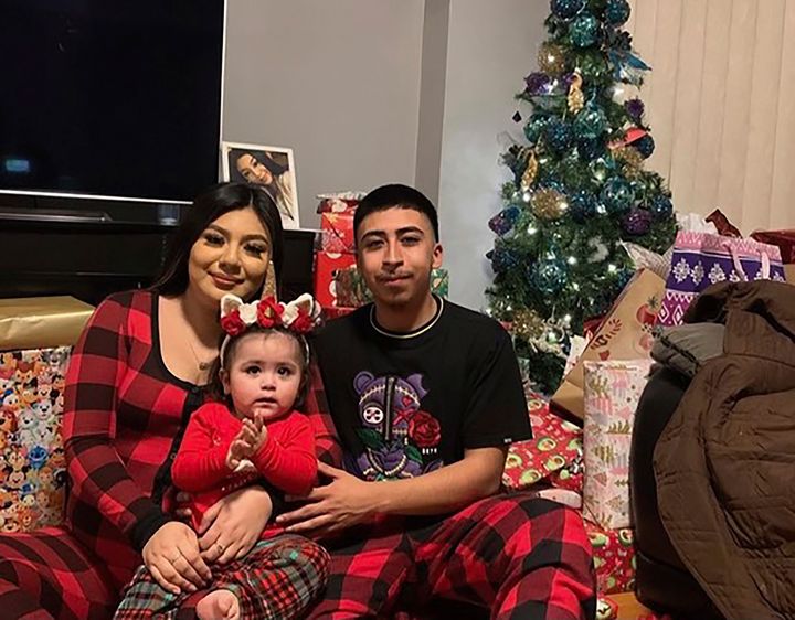 This undated family photo provided by Todd Pugh and Tania Dimitrova, Attorneys for the Alvarez family, shows Giselle Higuera, left, Anthony Alvarez, right, with their daughter in Chicago. Alvarez was shot and killed after a foot chase with Chicago Police on March 31, 2021. (Courtesy Giselle Higuera and the Alvarez family via AP)