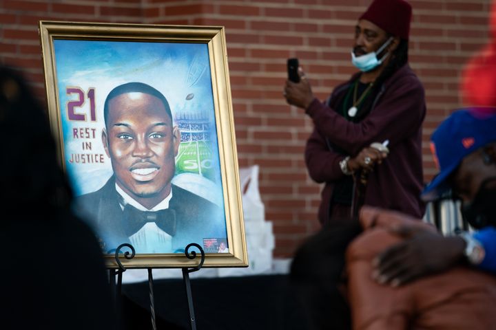 A painting of Ahmaud Arbery is displayed at a vigil at New Springfield Baptist Church in Waynesboro, Georgia, on Feb. 23, 2021, a year after Arbery was gunned down while jogging in Brunswick, Georgia.