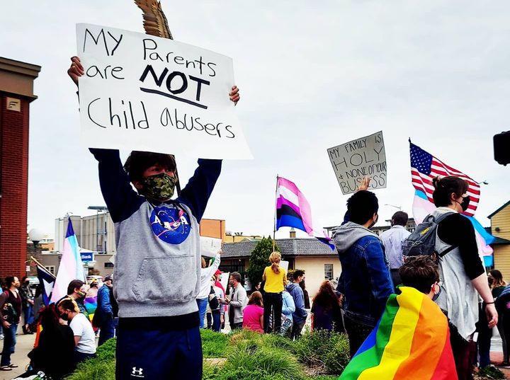 Adam Briggle's 13-year-old son, who's trans, protests outside of the office of his family's state representative, who co-sponsored one of many bills across the nation targeting trans youth.