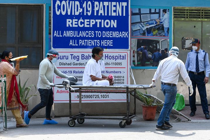 A coronavirus patient is shifted to a ward after admission at GTB hospital in New Delhi on April 29, 2021. 