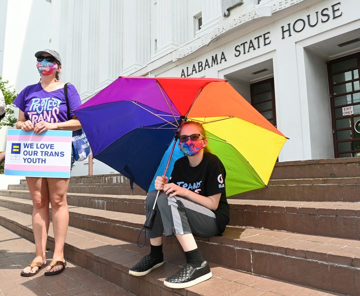 Christa White, left, and her daughter attend a rally at the Alabama State House to draw attention to the anti-transgender legislation introduced March 30.