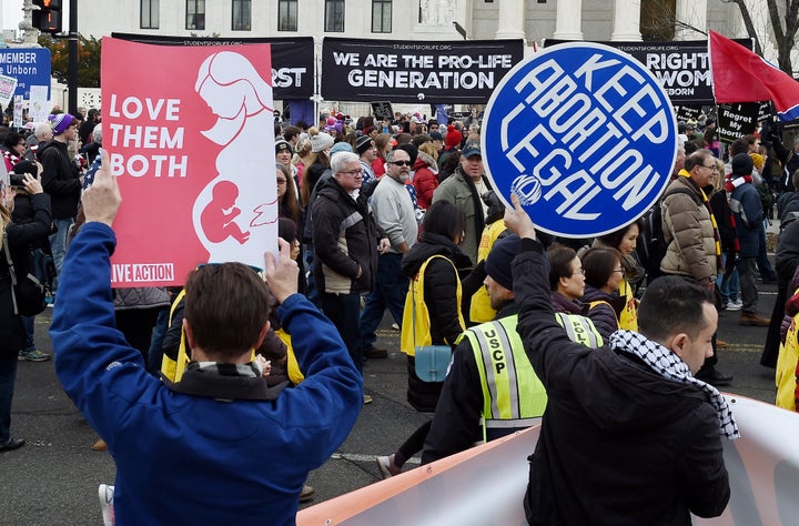 Pro-choice and anti-abortion activists demonstrate in front of the U.S. Supreme Court on Jan. 24, 2020.