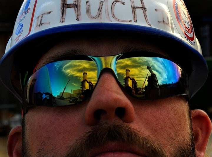 Boilermaker Lloyd Hutchinson watches workers construct an exhaust tower at the natural-gas-fired electric plant in Dresden, Ohio.