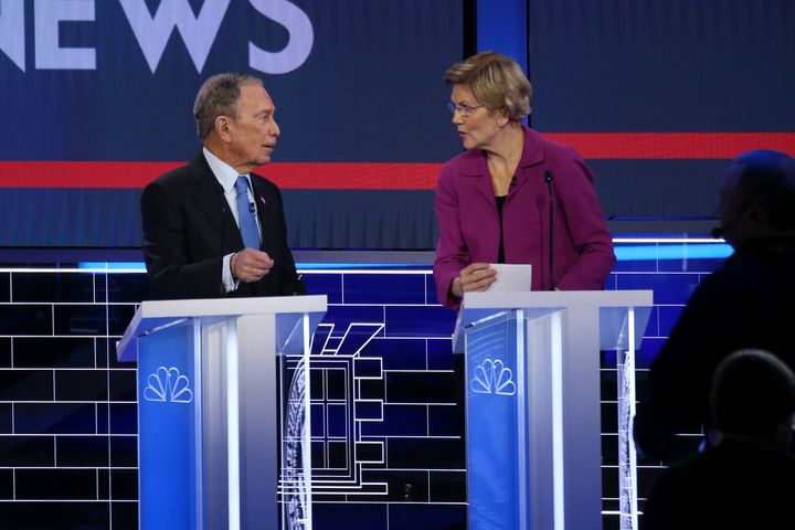 Former New York City Mayor Mike Bloomberg and Sen. Elizabeth Warren (D-Mass.) speak during the Democratic presidential primary debate in Las Vegas on Feb. 19, 2020.