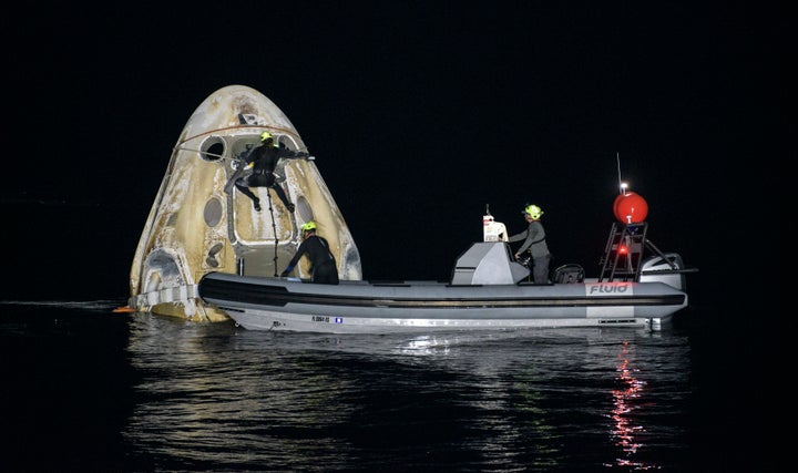 PANAMA CITY, FL. - MAY 02: In this NASA handout, Support teams work around the SpaceX Crew Dragon Resilience spacecraft short