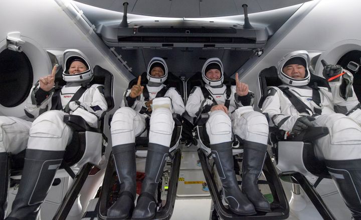 PANAMA CITY, FL. - MAY 02: In this NASA handout, NASA astronauts Shannon Walker, left, Victor Glover, Mike Hopkins, and Japan Aerospace Exploration Agency (JAXA) astronaut Soichi Noguchi, right are seen inside the SpaceX Crew Dragon Resilience spacecraft onboard the SpaceX GO Navigator recovery ship shortly after having landed in the Gulf of Mexico on Sunday, May 2, 2021, off the coast of Panama City, Florida. (Photo by Bill Ingalls/NASA via Getty Images)