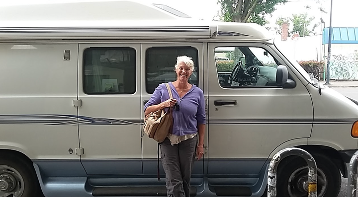 The author standing in front of her van, “Roadcinante,” in downtown Portland, Oregon (2017).