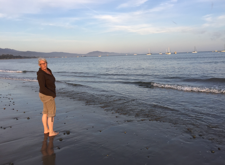 The author with her feet in the Pacific Ocean in Santa Barbara, California (2017).