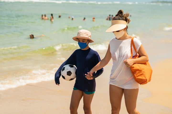 Experts say wearing a mask at the beach likely isn't necessary.