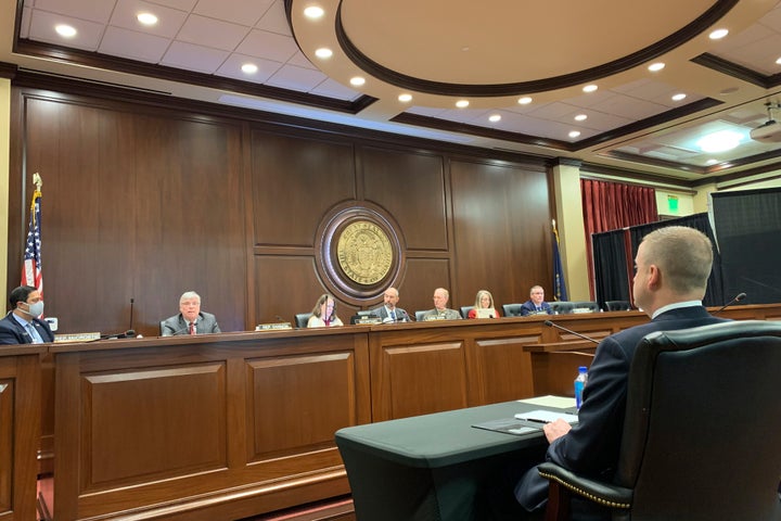 Idaho state Rep. Aaron von Ehlinger, right, a Republican from Lewiston, watches as members of the House ethics committee discuss whether he acted in a way that was "unbecoming" to his position in connection with rape allegations brought against him by a 19-year-old intern, during a hearing in Boise, Idaho, on Thursday, April 29, 2021. The committee unanimously agreed on Thursday that von Ehlinger should be formally censured and suspended from his office, and that a new lawmaker should be appointed to serve in his place. The full House could vote on the matter as soon as Friday. (AP Photo/Rebecca Boone)