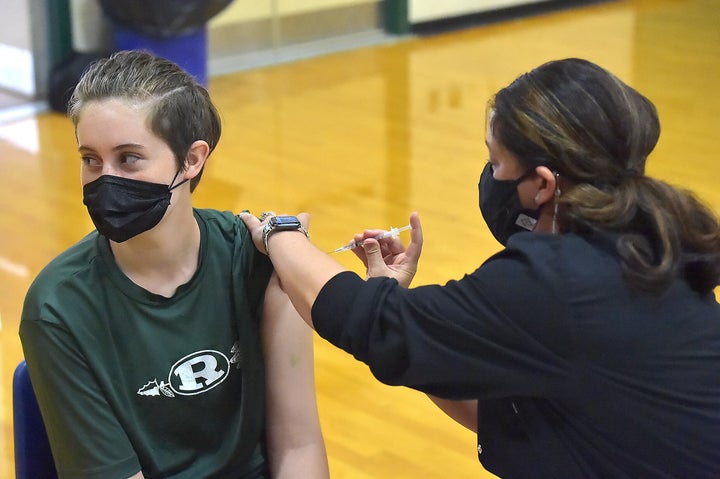 Students ages 16 to 18 and parents are given the Pfizer-BioNTech COVID-19 vaccine at Ridley High School in Folsom, Pennsylvania, on Monday.