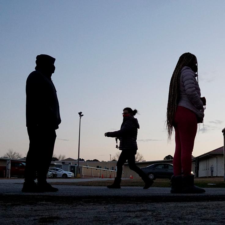 Voters stand in line at a polling station at the Gwinnett County Fairgrounds on Jan. 5, 2021, in Lawrenceville, Georgia. 