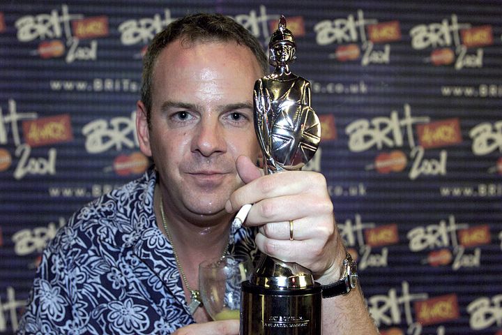 Norman Cook of Fatboy Slim poses with his Brit Award
