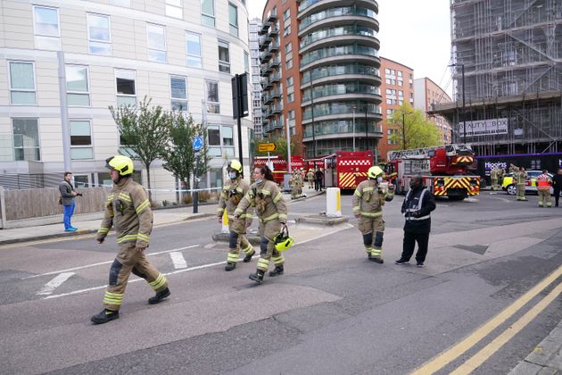 <strong>Firefighters at the scene in New Providence Wharf in London.</strong>” data-caption=”<strong>Firefighters at the scene in New Providence Wharf in London.</strong>” data-rich-caption=”<strong>Firefighters at the scene in New Providence Wharf in London.</strong>” data-credit=”Yui MokPA” data-credit-link-back=”” /></p>
<div class=