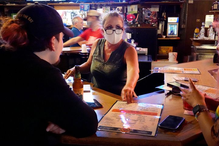 Customers eat and drink at the Brat Stop, a popular bar, restaurant and tourist attraction on May 15, 2020, in Kenosha, Wisconsin.