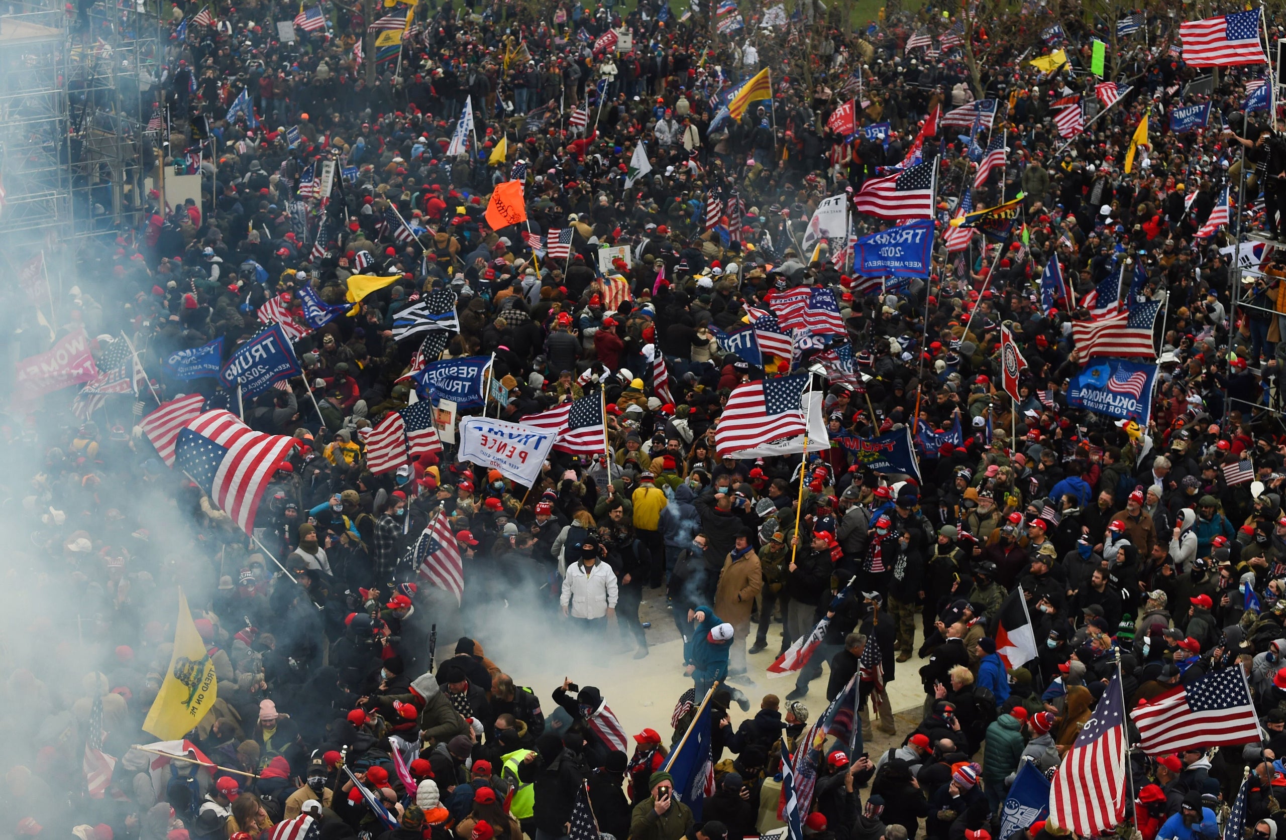 Trump supporters clash with police and security forces as they storm the U.S. Capitol on Jan. 6. Demonstrators entered the Ca