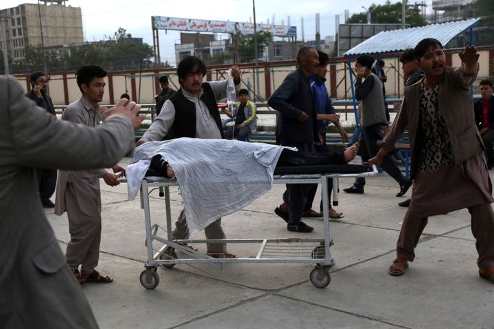 An injured school student is transported to a hospital after a bomb explosion near a school in west of Kabul, Afghanistan, Saturday, May 8, 2021. (AP Photo/Rahmat Gul)