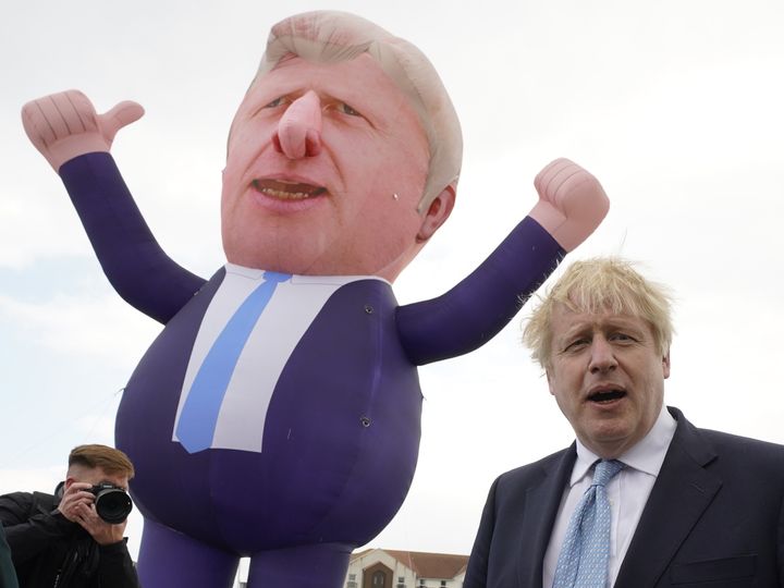 Boris Johnson in front of a giant inflatable of himself as he meets and newly elected Tory MP Jill Mortimer at Jacksons Wharf in Hartlepool