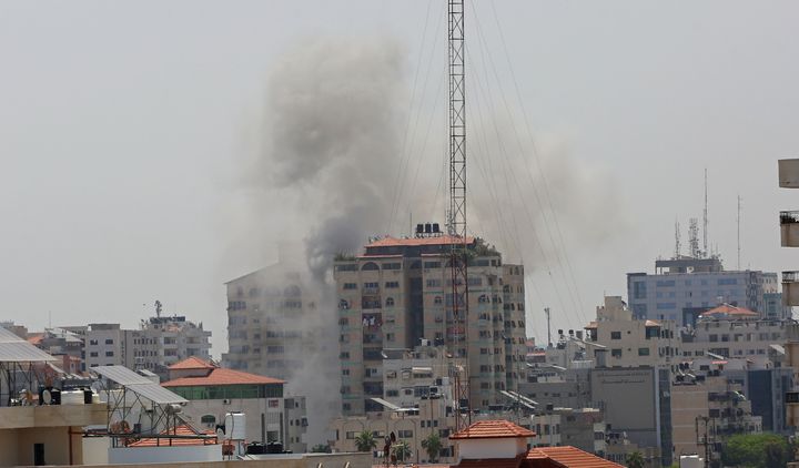 Smoke rises from an apartment in Gaza City after Israeli warplanes conducted airstrikes in various parts of Gaza Strip on May