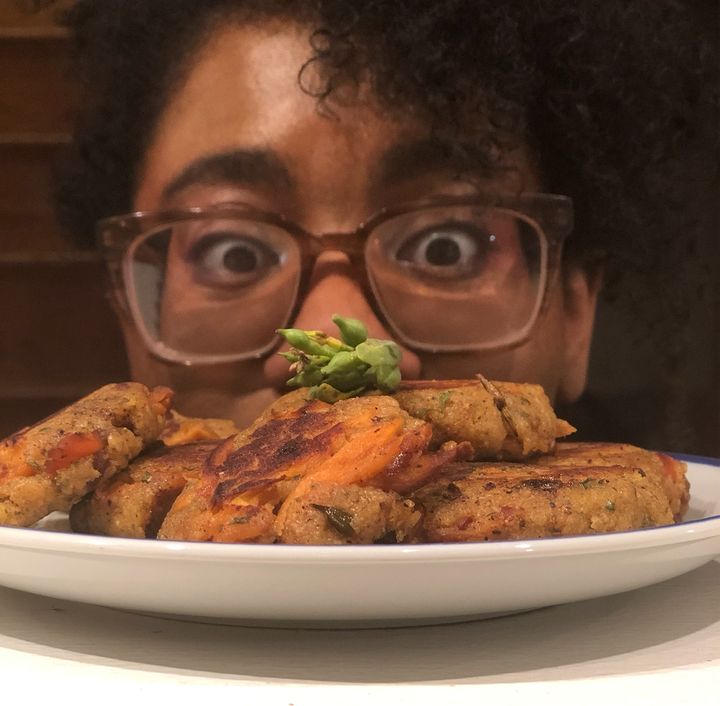 Nelson peers over a bowl of "Chicken of the Woods Cakes," which are like crabcakes, but made with pickled chicken of the woods mushrooms instead of crabmeat.