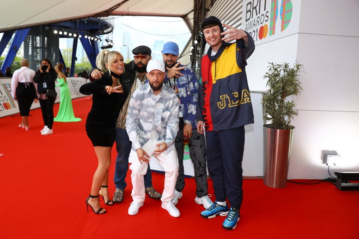 Sheridan Smith poses with the Kurupt FM team backstage at the Brits