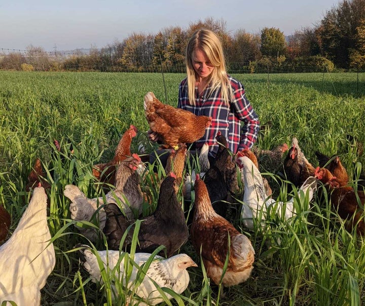 Abby Johnson surrounded by her HenPals hens.