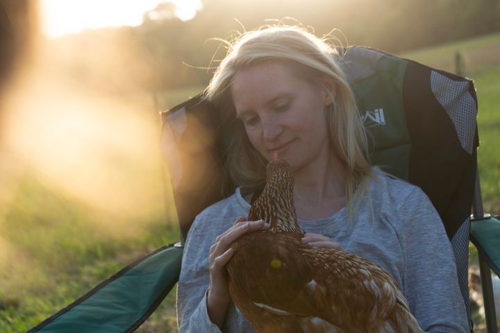 Abby Johnson with one of her hens.
