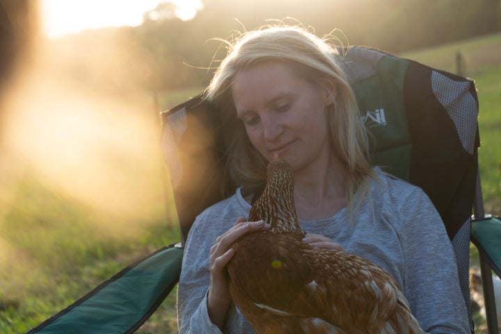 Abby Johnson with one of her hens.