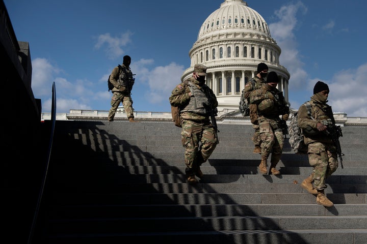 Members of the National Guard patrol the grounds of the U.S. Capitol on March 4, 2021, in Washington, D.C., after the FBI and Homeland Security Department warned that violent militia groups and QAnon followers had discussed attacking the legislature that day.