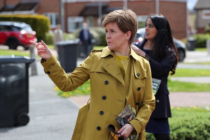 AIRDRIE, SCOTLAND - MAY 12: First Minister Nicola Sturgeon and SNP candidate Anum Qaisar-Javed during a visit to Airdrie ahead of a by-election on May 12, 2021 in Airdrie, Scotland. (Photo by Russell Cheyne - Pool/Getty Images)