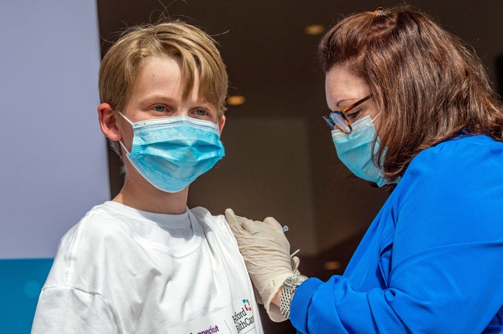 An adolescent gets vaccinated in Hartford, Connecticut.